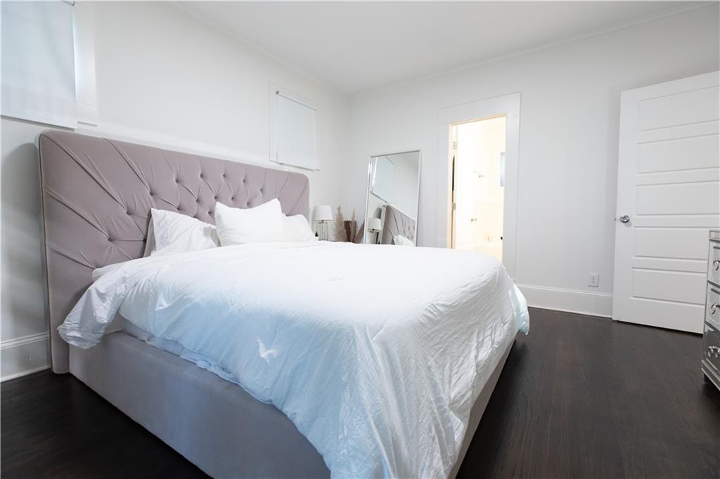 938 Ormewood Avenue Southeast Atlanta, GA 30316 - Photo 14 of 21 a large bed sitting in a bedroom next to a window