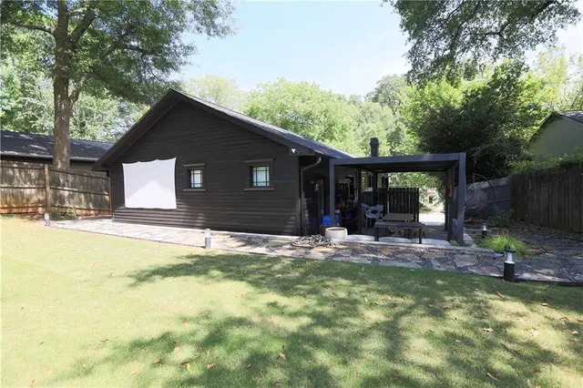 a view of a yard in front of a house with a yard