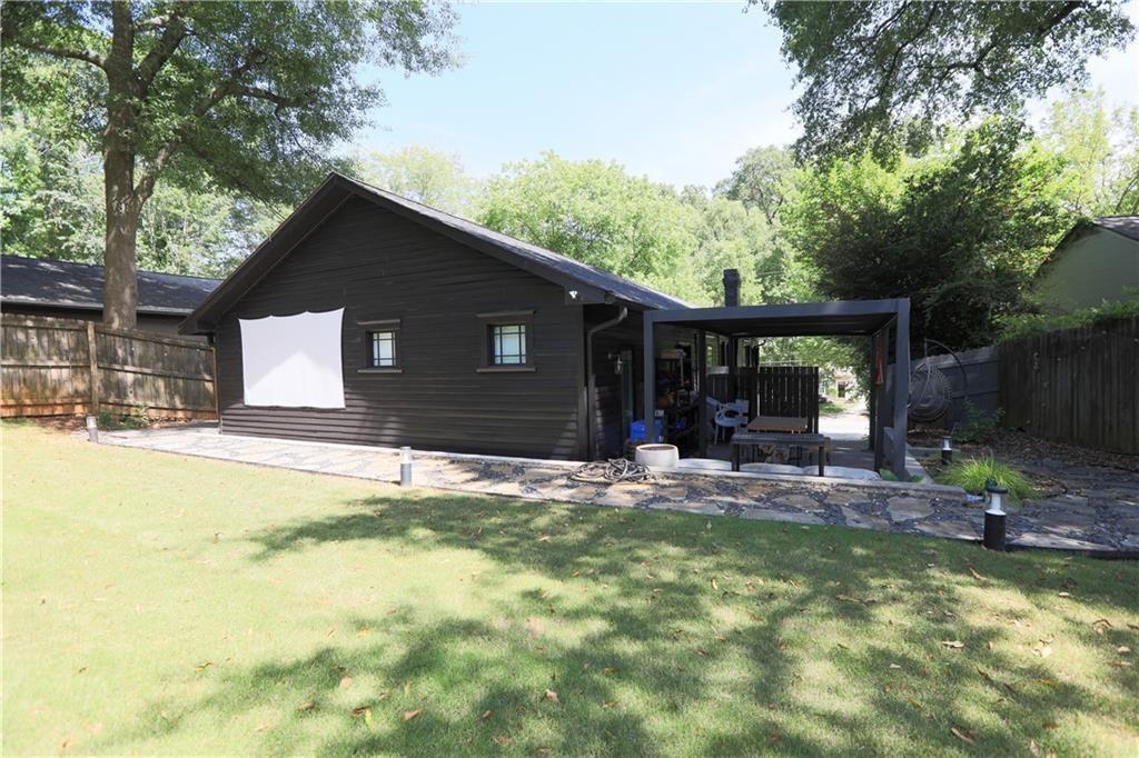 938 Ormewood Avenue Southeast Atlanta, GA 30316 - Photo 18 of 21 a swimming pool with outdoor seating and yard