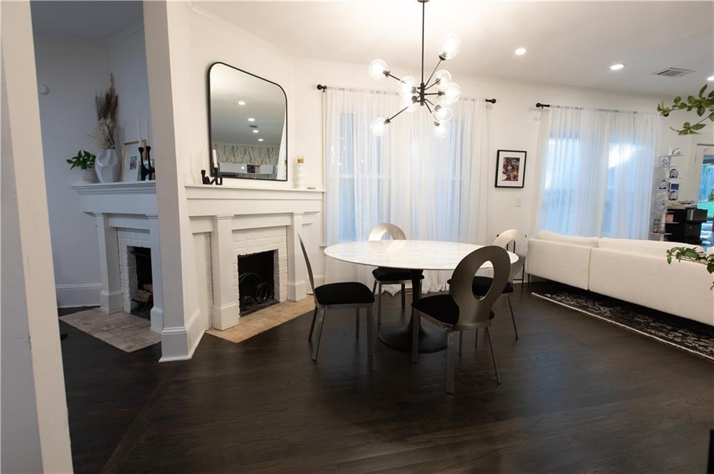 938 Ormewood Avenue Southeast Atlanta, GA 30316 - Photo 4 of 21 a dining room with a table chairs and a kitchen view