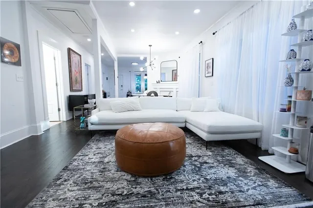 a living room with furniture and a rug