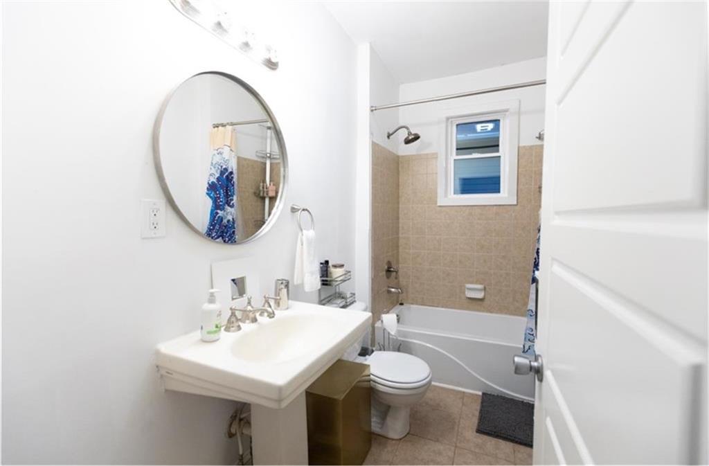 938 Ormewood Avenue Southeast Atlanta, GA 30316 - Photo 9 of 21 a bathroom with a toilet sink and mirror