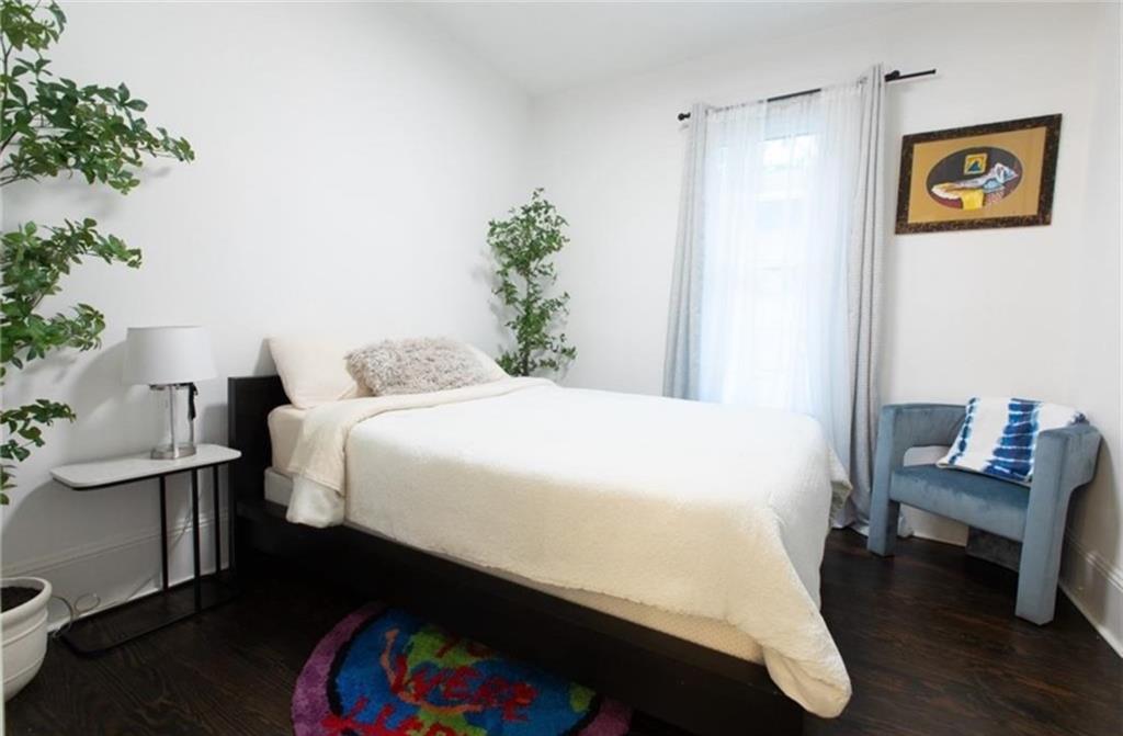 938 Ormewood Avenue Southeast Atlanta, GA 30316 - Photo 10 of 21 a bedroom with a bed and a couch