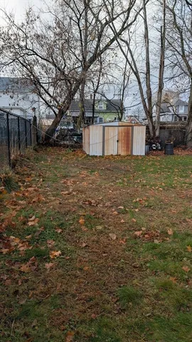 a house that has a tree in front of it