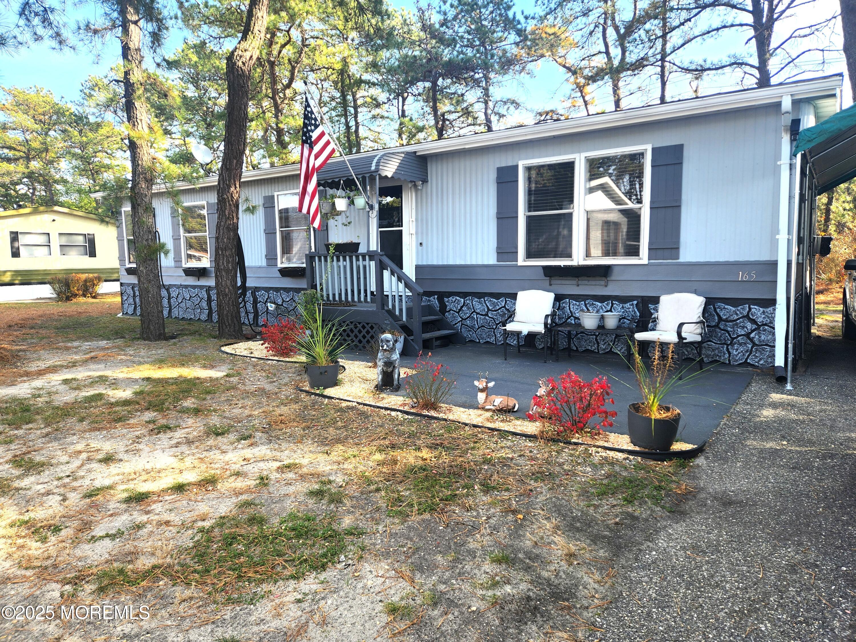 a view of a house with a yard covered in snow
