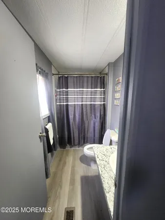 a bed room with a bed and a window