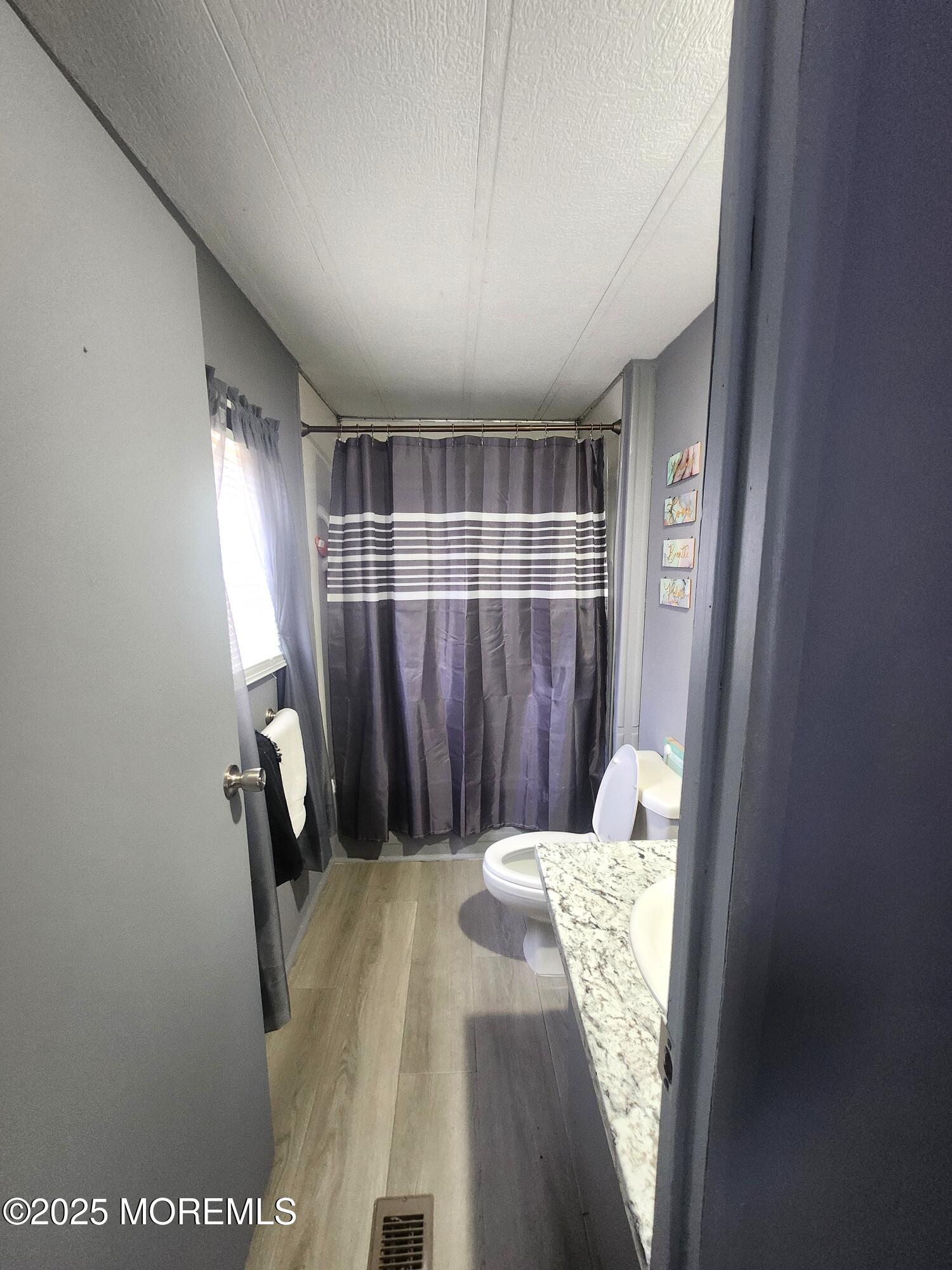 165 Mockingbird Way Manchester Township, NJ 08759 - Photo 16 of 20 a bed room with a bed and a window