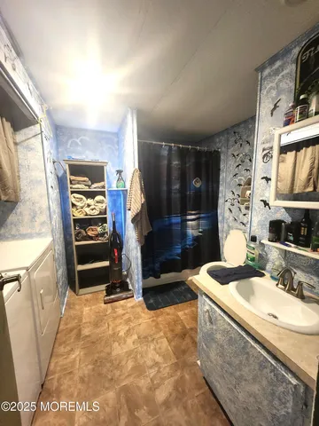 a bathroom with a sink a vanity and a mirror