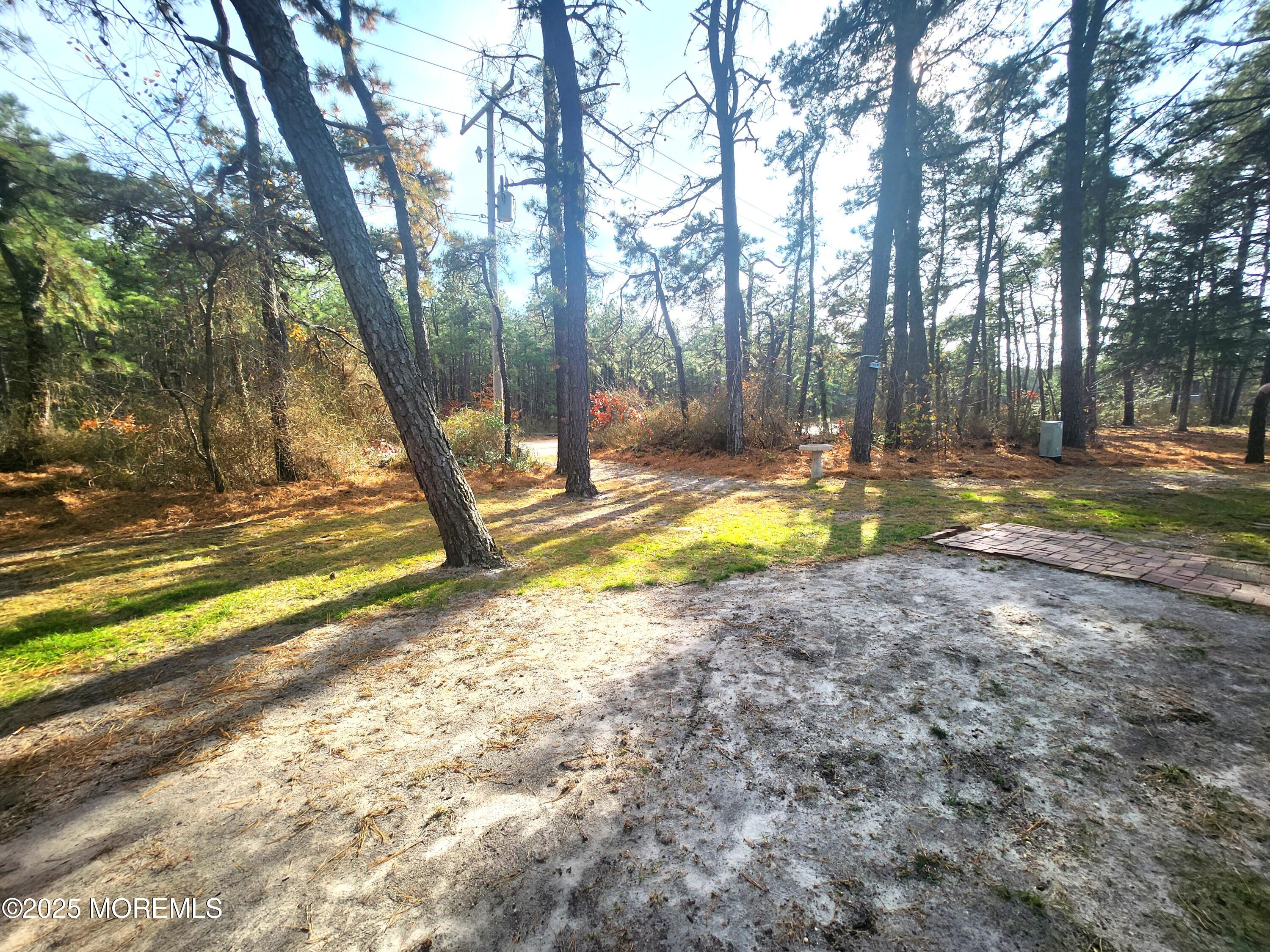 165 Mockingbird Way Manchester Township, NJ 08759 - Photo 3 of 20 a view of a yard with swimming pool