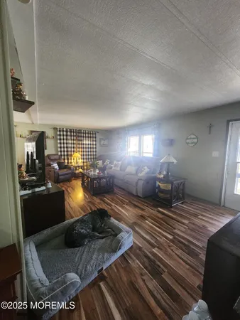 a bedroom with a bed window and couch
