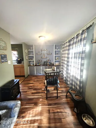 a living room with furniture and a piano