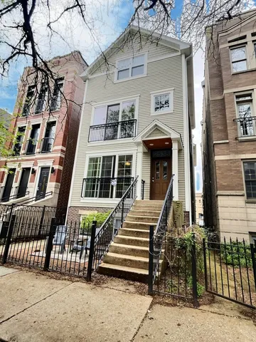 front view of a brick house with many windows