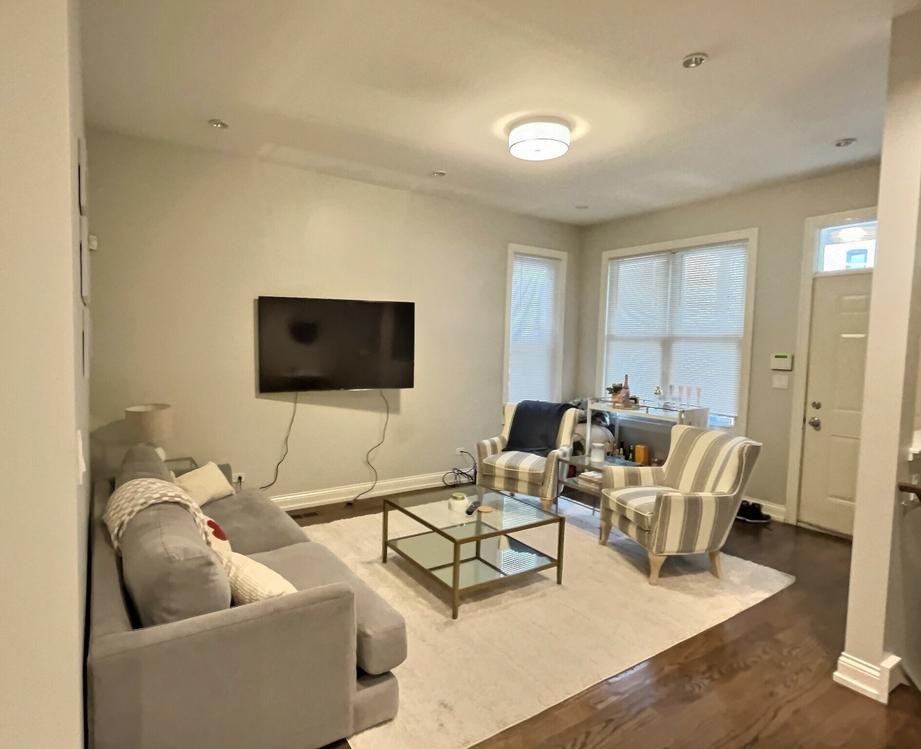 2538 North Southport Avenue, Unit 1R Chicago, IL 60614 - Photo 3 of 12 a living room with furniture and a flat screen tv