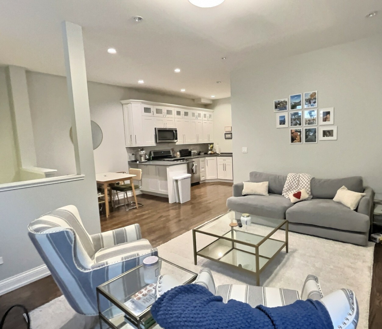 2538 North Southport Avenue, Unit 1R Chicago, IL 60614 - Photo 4 of 12 a living room with furniture a rug and kitchen view