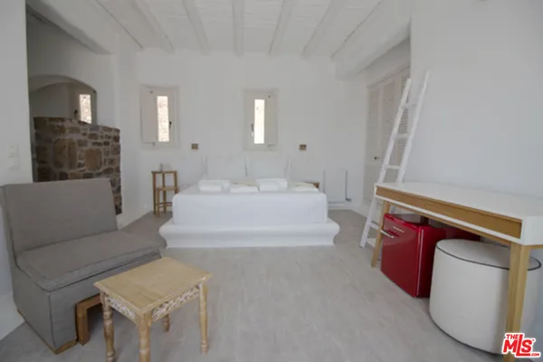 a living room with furniture and a rug