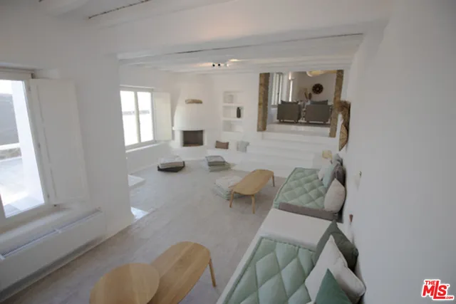 a view of a room with a sink and a fireplace