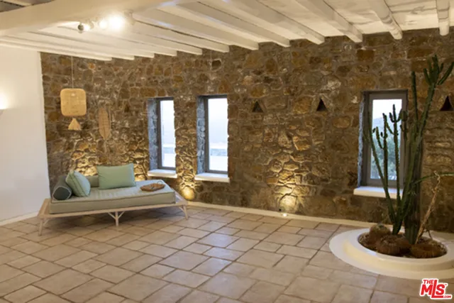 a white bath tub sitting next to a white sink