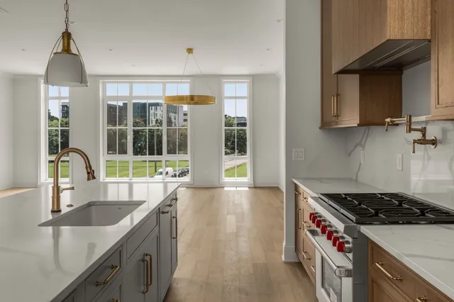 a kitchen that has a sink and a stove