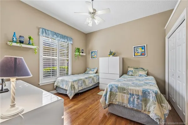 a bedroom with furniture and a window