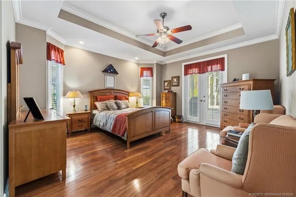 a bedroom with a bed a couch and dresser