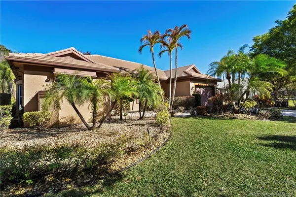 a view of a house with a yard and plants