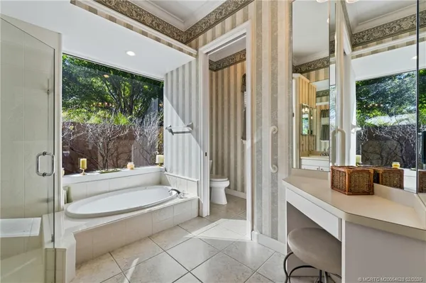 a bathroom with a tub and sink