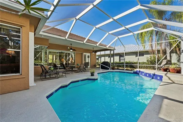 a view of a swimming pool with a patio