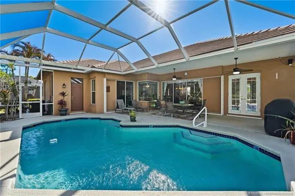 a view of a swimming pool with a patio