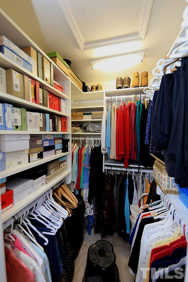 2041 Rivergate Road, Unit 103 Raleigh, NC 27614 - Photo 11 of 21 Check out this great custom walk-in closet, one of TWO in the master suite!