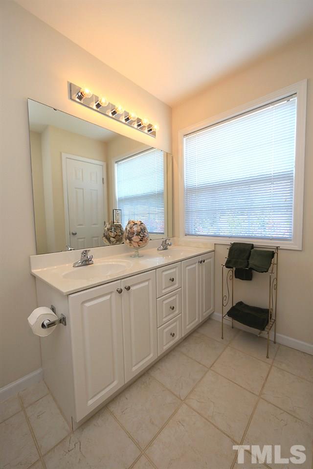 2041 Rivergate Road, Unit 103 Raleigh, NC 27614 - Photo 12 of 21 Loads of natural light afforded in the master bath, with dual vanities, a large garden tub/shower and generous linen closet