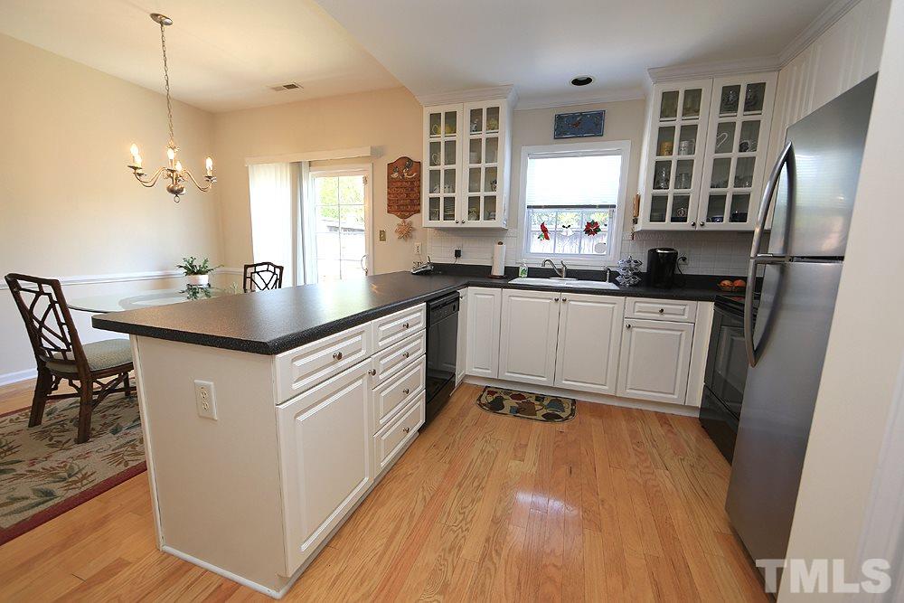 2041 Rivergate Road, Unit 103 Raleigh, NC 27614 - Photo 5 of 21 Sunny and bright kitchen with generous peninsula