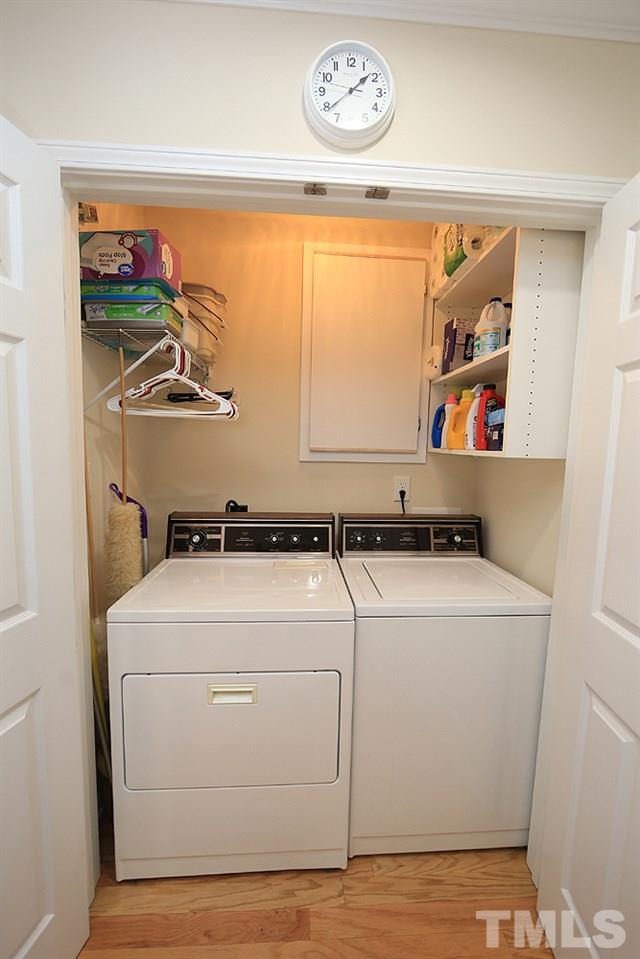 2041 Rivergate Road, Unit 103 Raleigh, NC 27614 - Photo 9 of 21 Convenient laundry location with additional shelving on main level. Washer/dryer both convey!