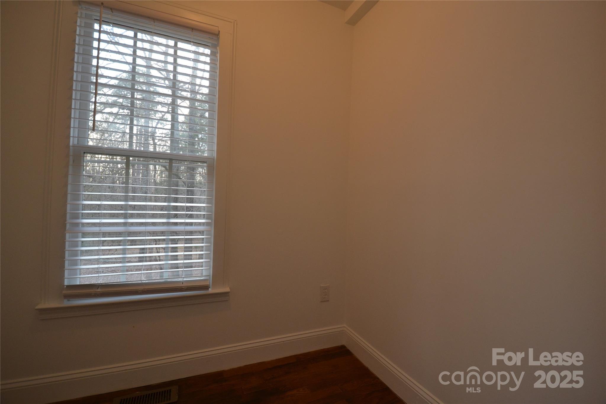 9024 McElroy Road Waxhaw, NC 28173 - Photo 13 of 43 a view of a small space with wooden floor and a window