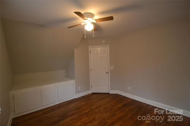 a view of room with window and ceiling fan
