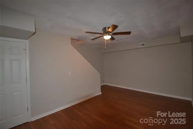 a view of a big room with wooden floor