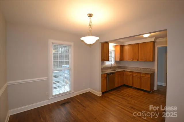 a kitchen with a refrigerator and stove