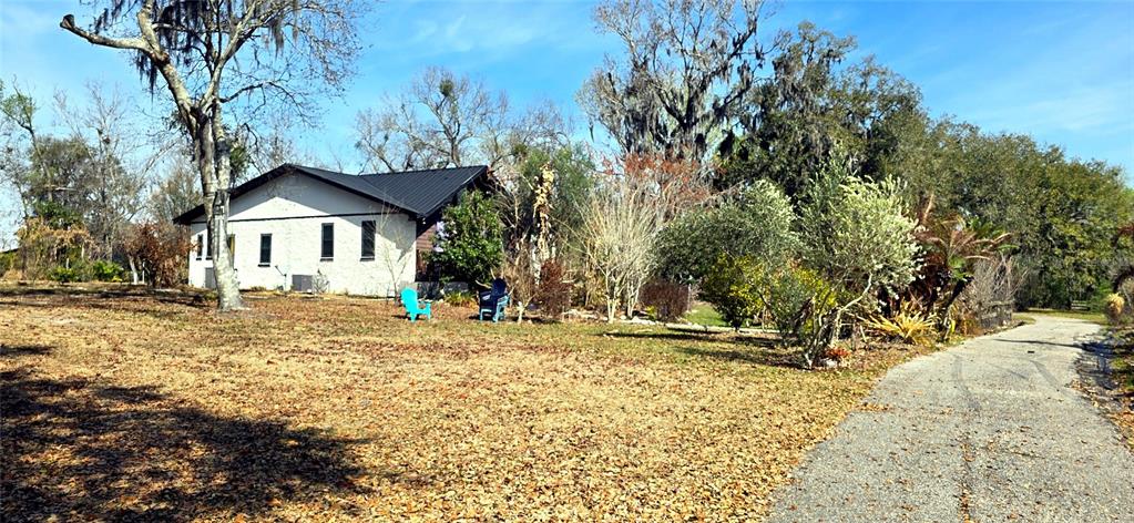 14820 County Road 48 Astatula, FL 34705 - Photo 1 of 12 a front view of a house with a yard
