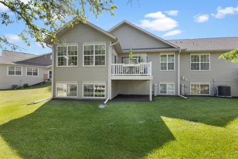a view of a house with a yard porch and sitting area