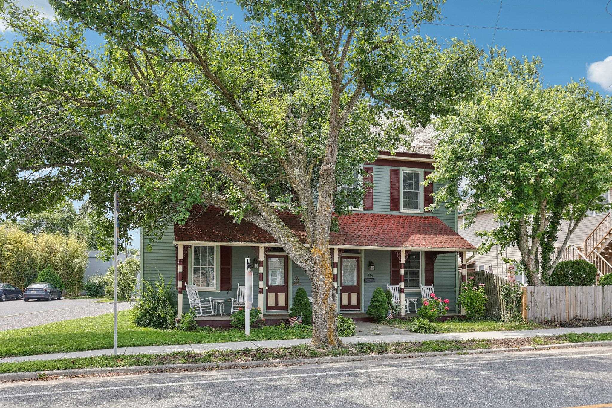414 Broadway, Unit 414 West Cape May, NJ 08204 - Photo 12 of 48 a front view of a house with a garden