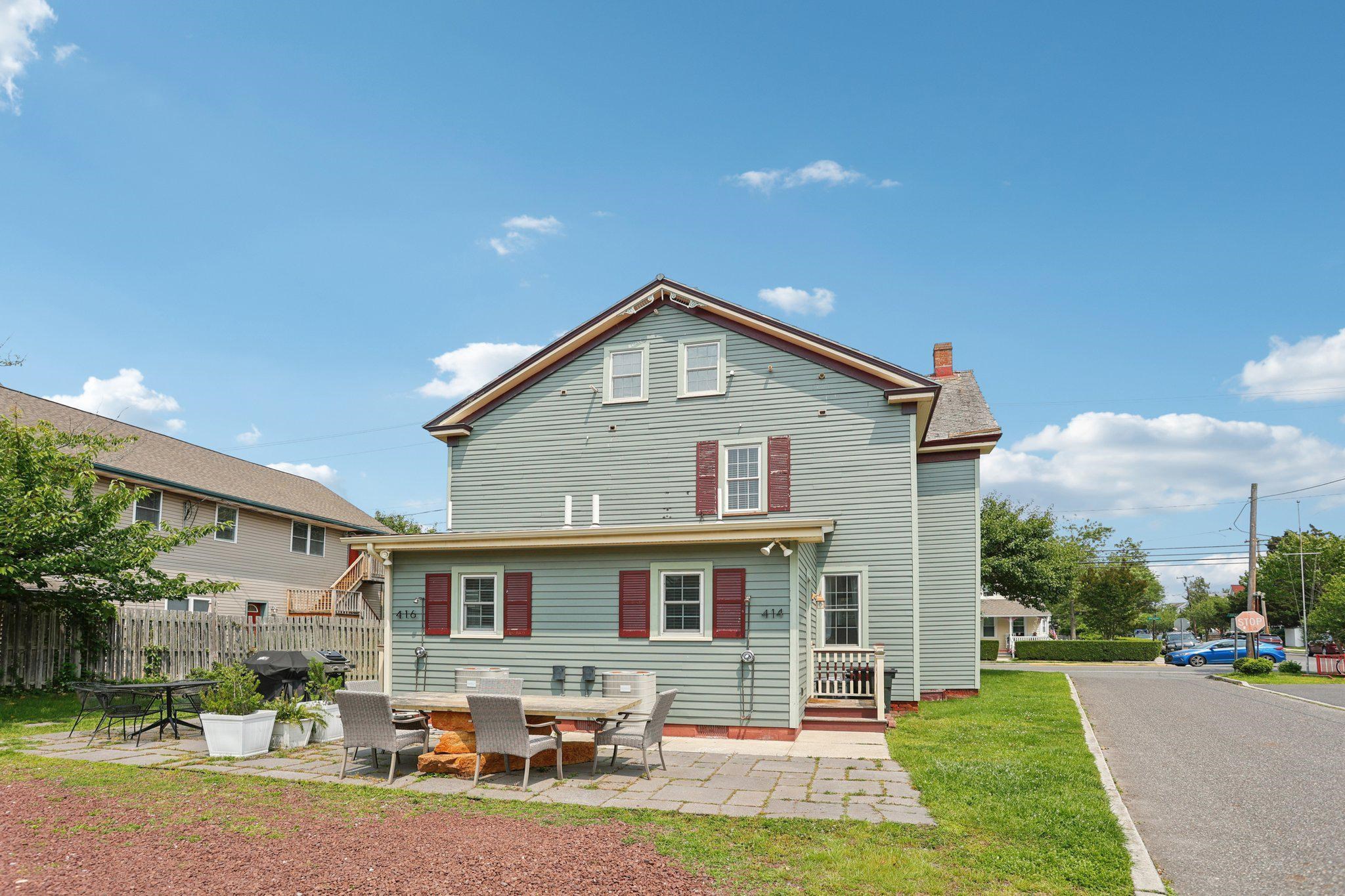 414 Broadway, Unit 414 West Cape May, NJ 08204 - Photo 17 of 48 a front view of house with yard and green space