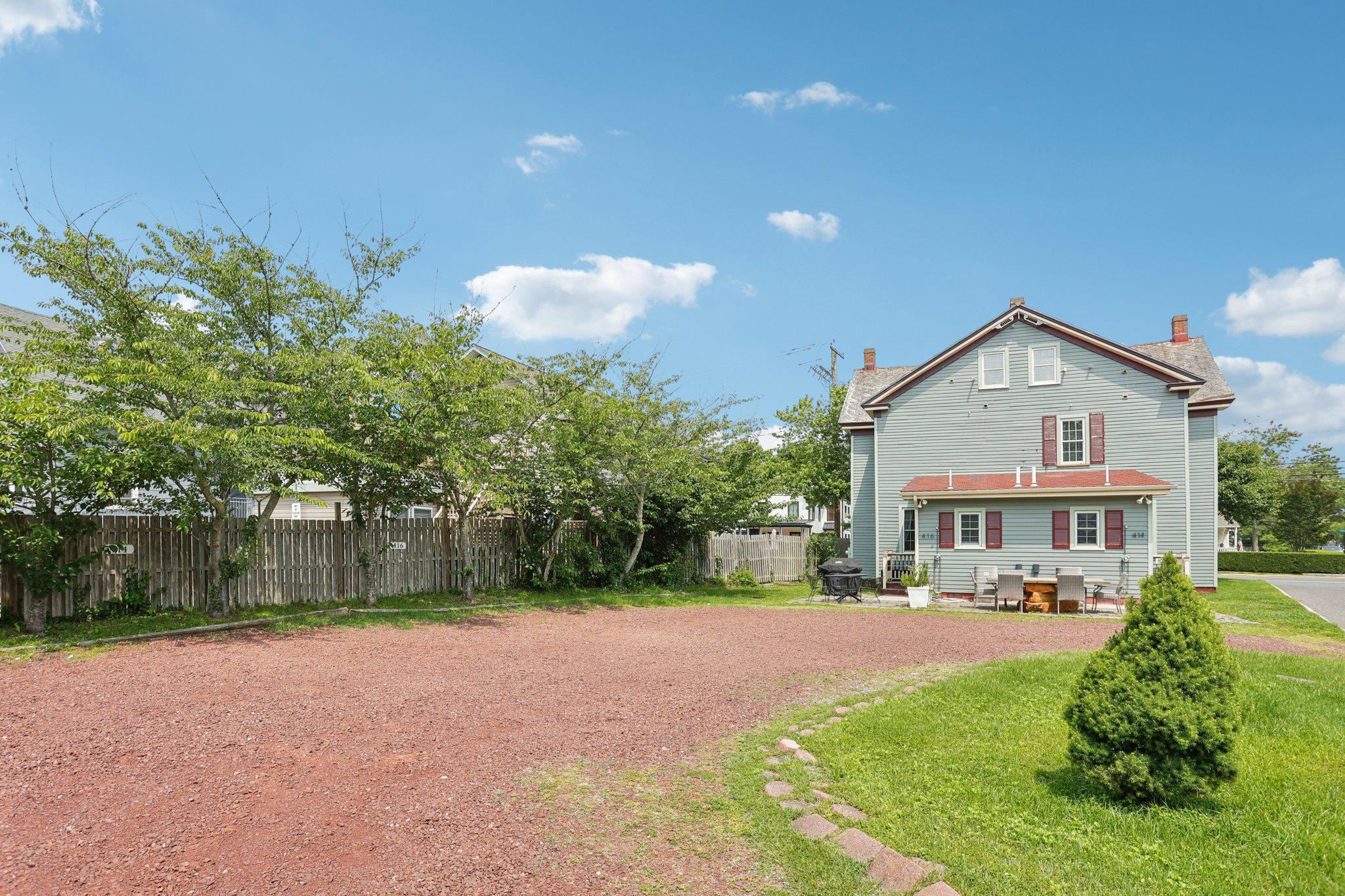 414 Broadway, Unit 414 West Cape May, NJ 08204 - Photo 18 of 48 a view of a big house with a yard and plants