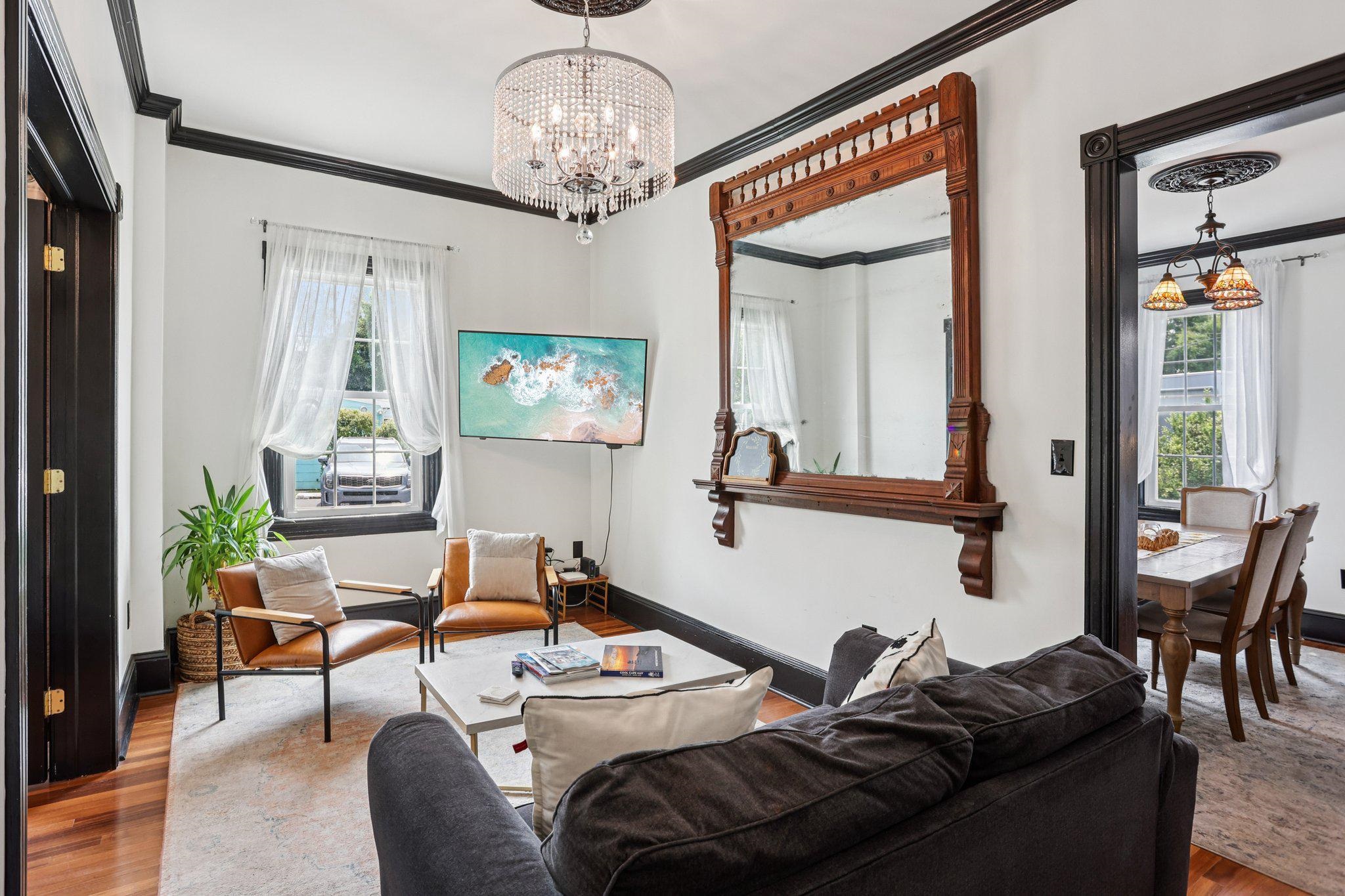 414 Broadway, Unit 414 West Cape May, NJ 08204 - Photo 26 of 48 a living room with furniture and a chandelier