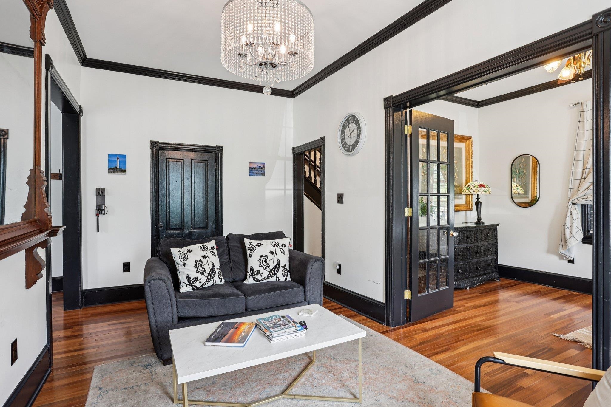 414 Broadway, Unit 414 West Cape May, NJ 08204 - Photo 28 of 48 a living room with furniture and a chandelier