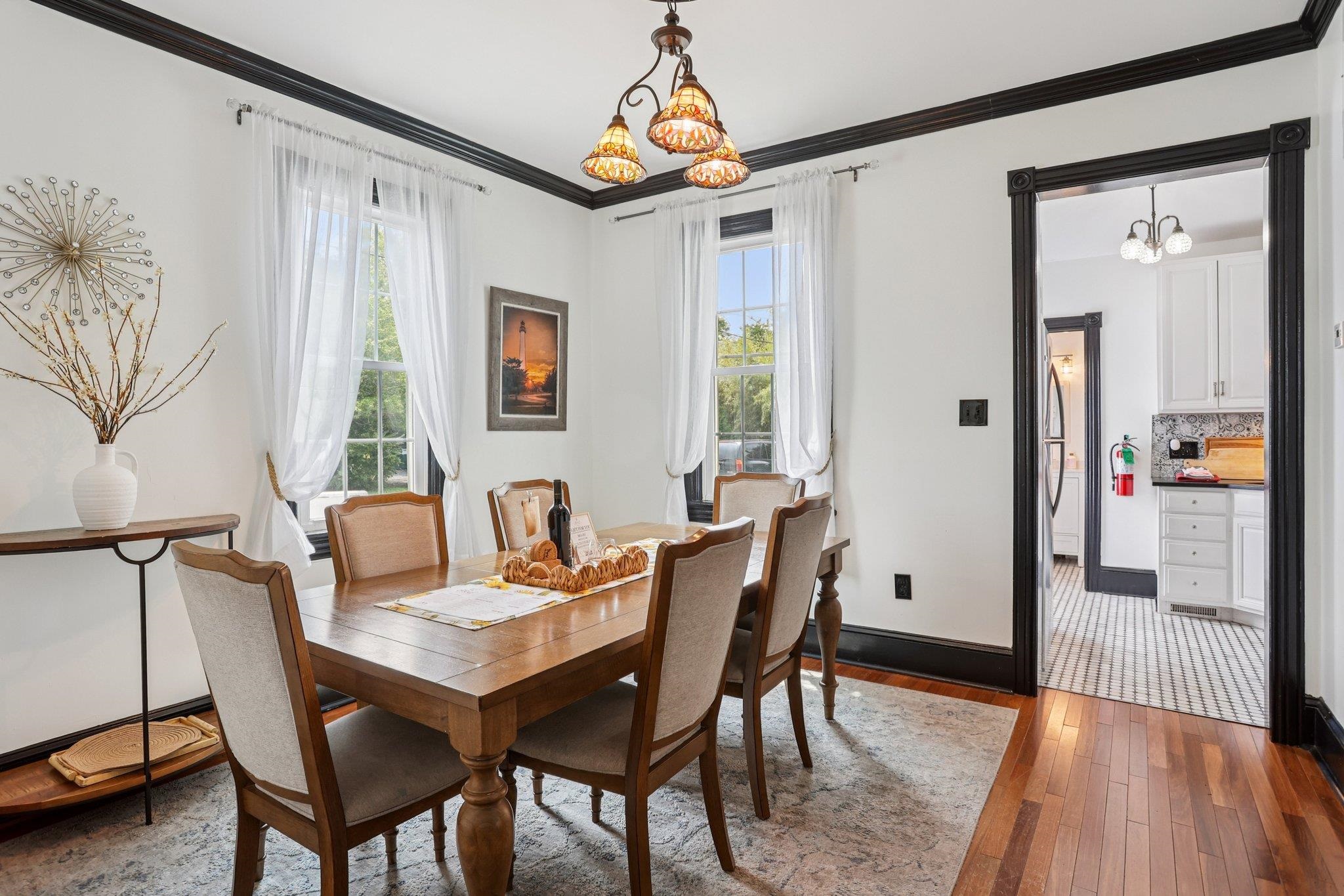 414 Broadway, Unit 414 West Cape May, NJ 08204 - Photo 31 of 48 a view of a a dining room with furniture window and wooden floor
