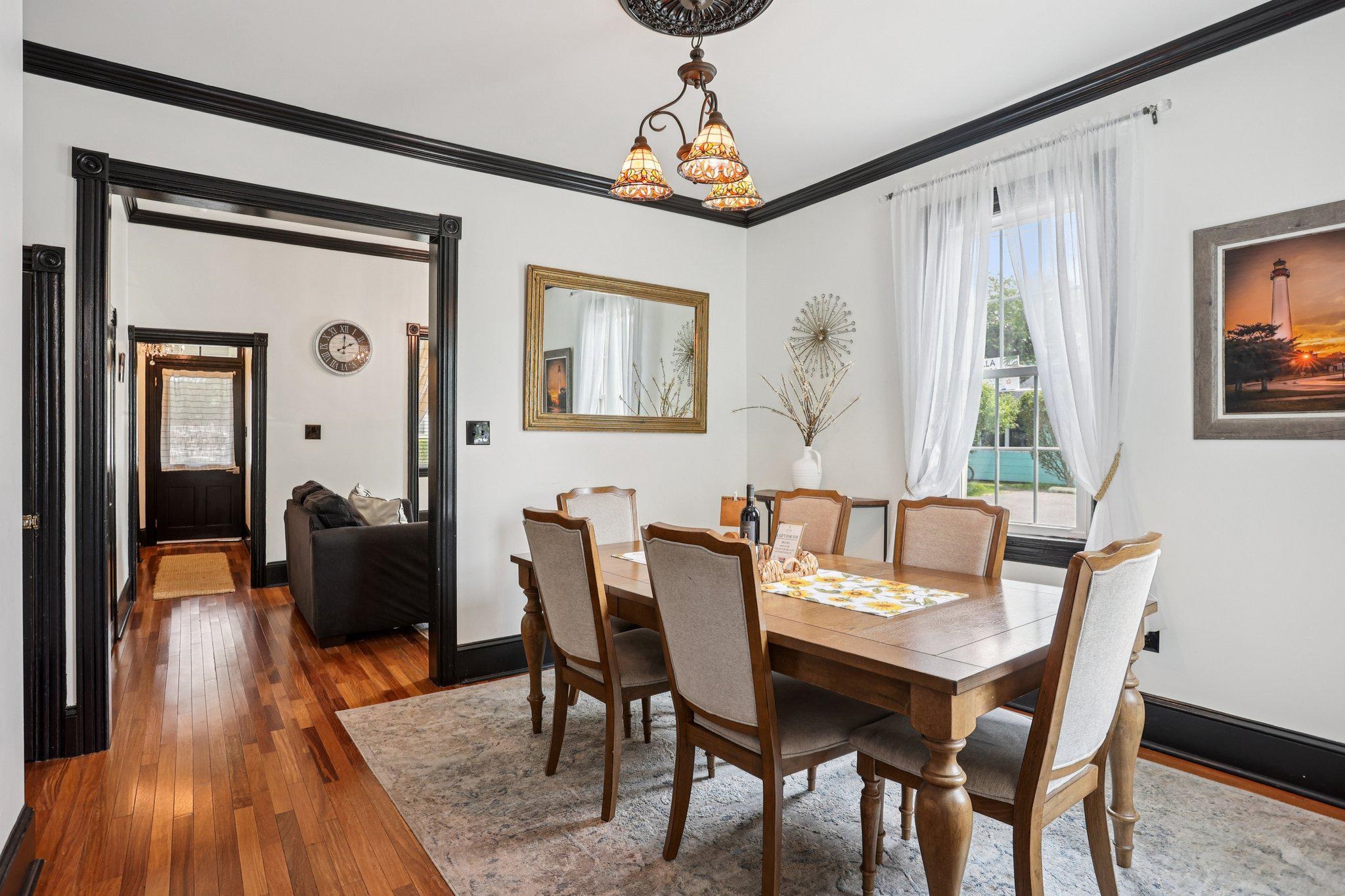 414 Broadway, Unit 414 West Cape May, NJ 08204 - Photo 32 of 48 a view of a dining room with furniture window and wooden floor