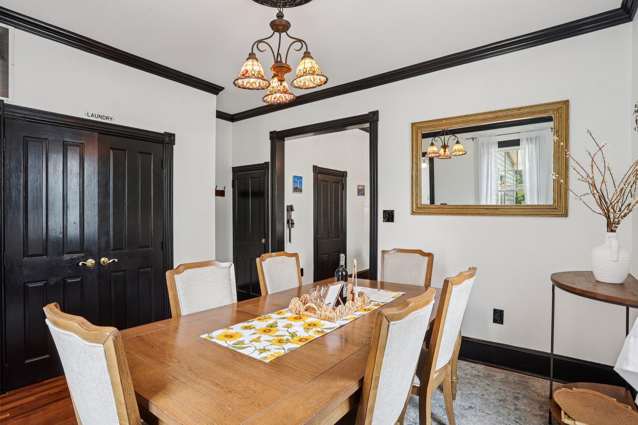 414 Broadway, Unit 414 West Cape May, NJ 08204 - Photo 33 of 48 a dining room with furniture a chandelier and window