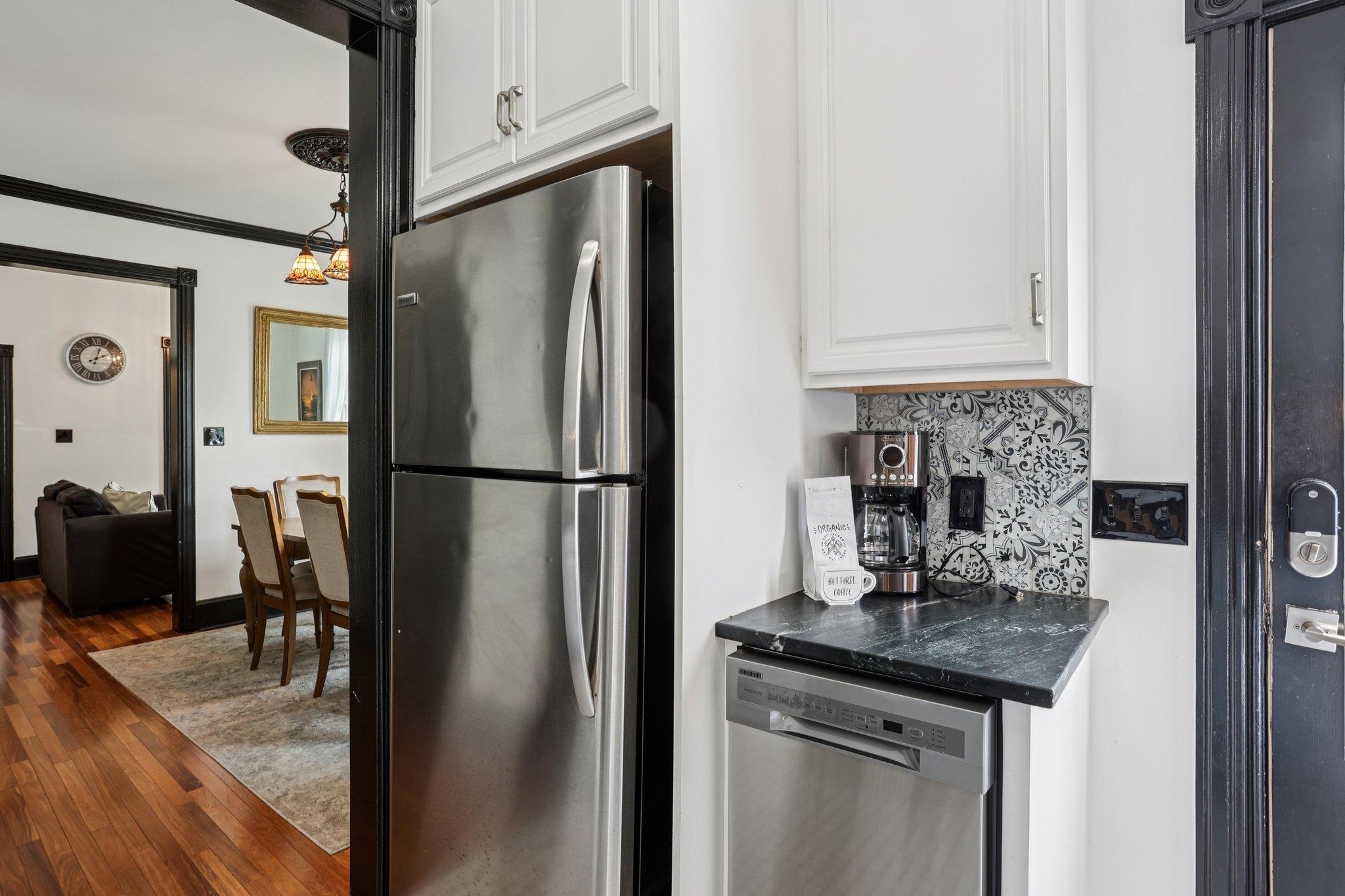 414 Broadway, Unit 414 West Cape May, NJ 08204 - Photo 36 of 48 a kitchen with stainless steel appliances granite countertop a refrigerator a sink and a stove