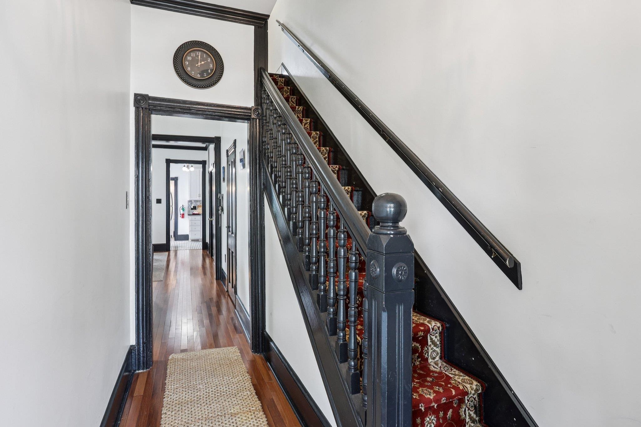 414 Broadway, Unit 414 West Cape May, NJ 08204 - Photo 40 of 48 a view of a hallway with wooden floor and staircase