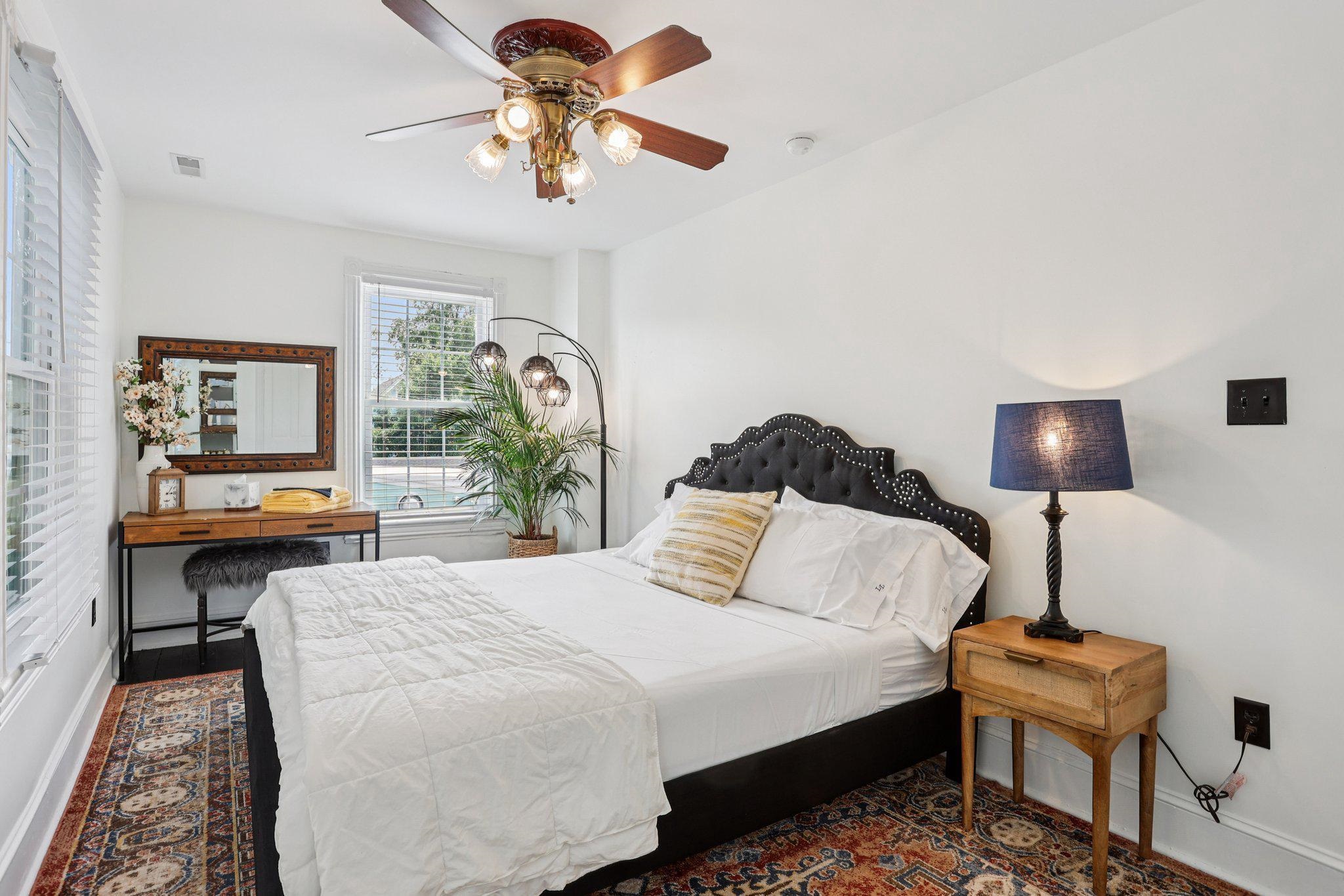 414 Broadway, Unit 414 West Cape May, NJ 08204 - Photo 42 of 48 a bedroom with a bed a desk and chair