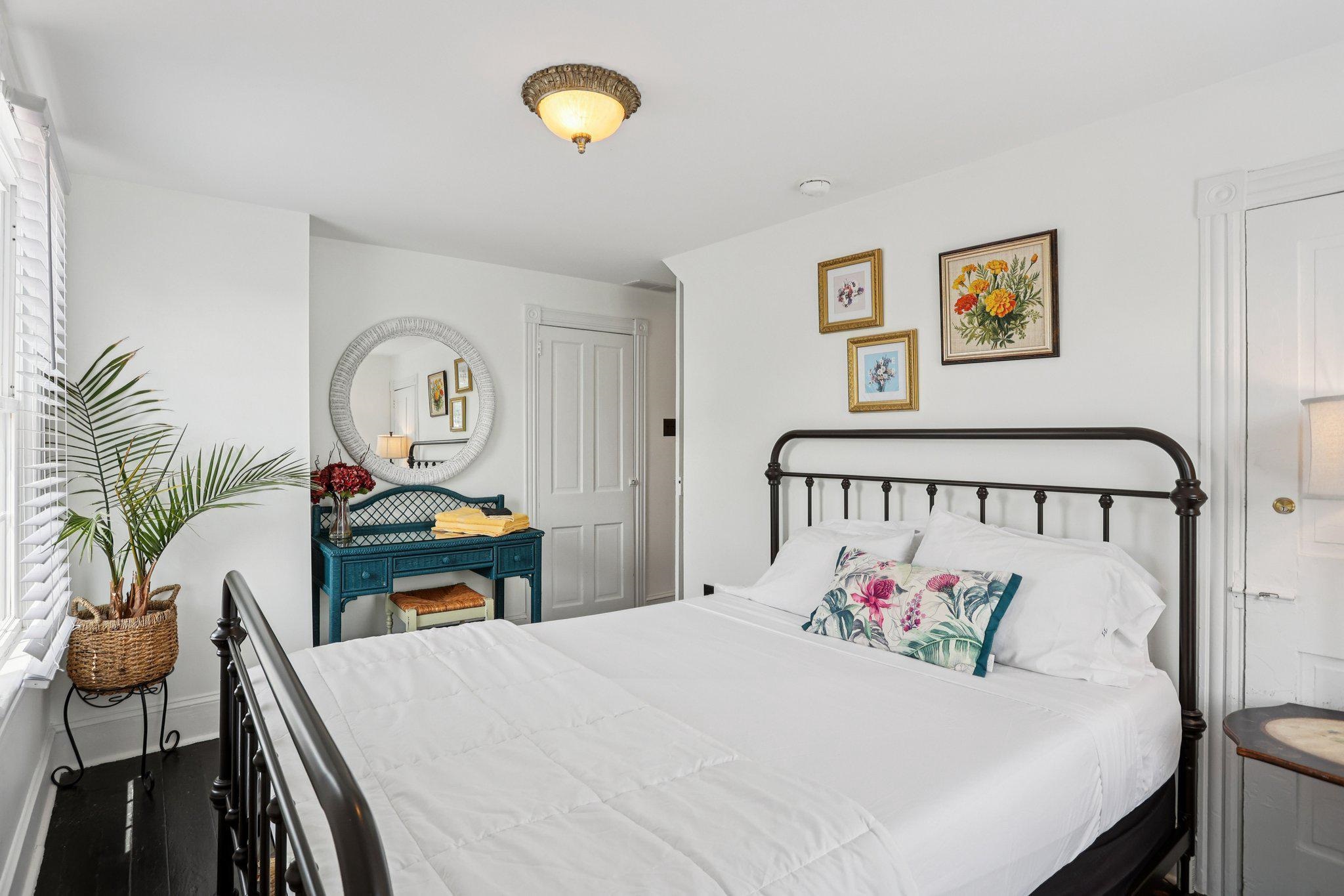 414 Broadway, Unit 414 West Cape May, NJ 08204 - Photo 46 of 48 a bedroom with a bed and a table